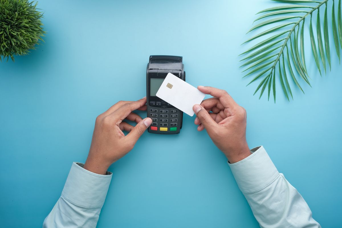 A bank card being tapped on a payment terminal