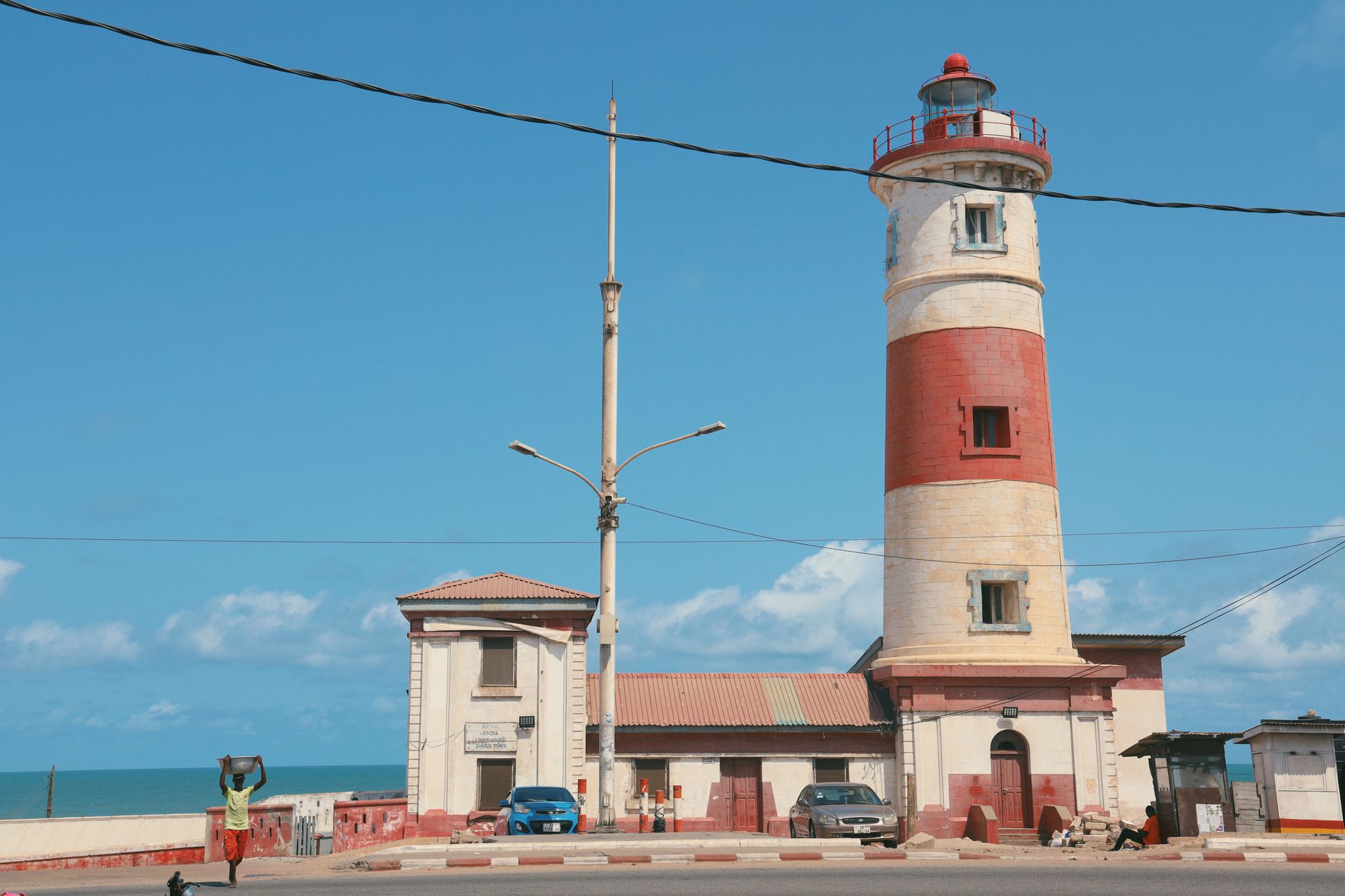 Street life and coastal landmarks in Accra